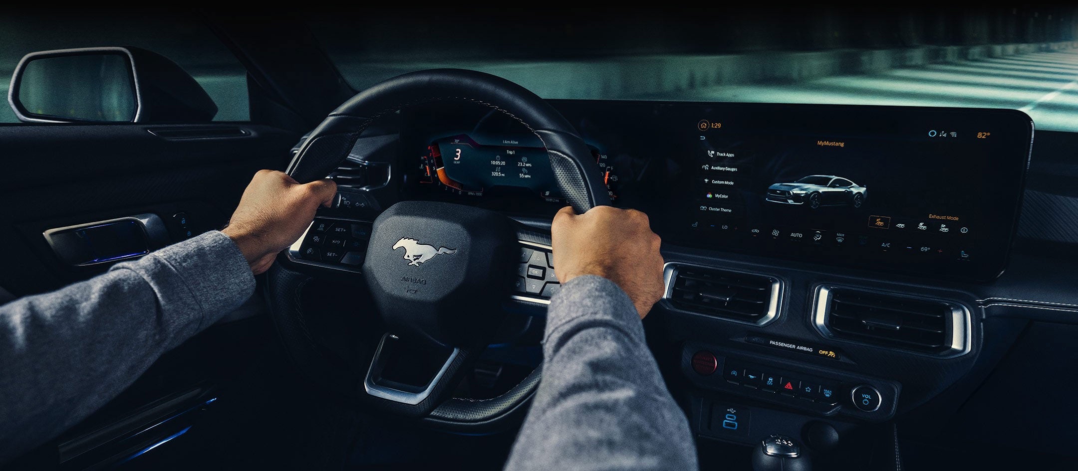 A 2024 Ford Mustang® model interior with a person driving | Keyser & Miller Ford Inc in Collegeville PA